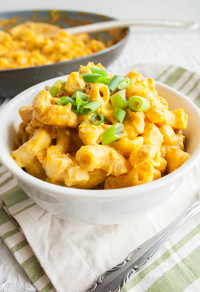 Nacho Mac and Cheese with green onions on top.