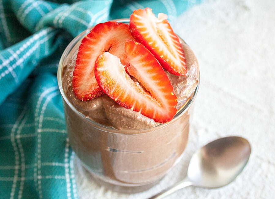 Chocolate Pudding in jar with spoon.