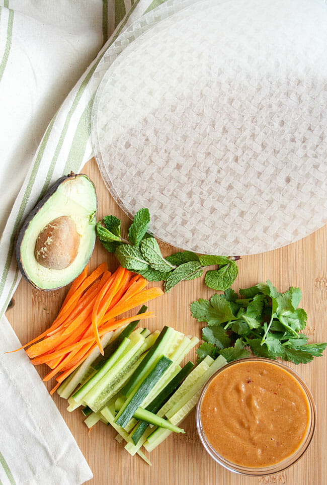 Ingredients for Vegan Summer Rolls with Peanut Sauce on cutting board.