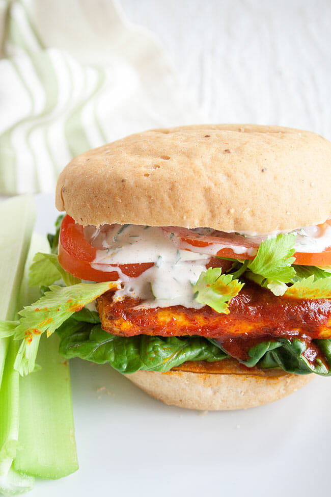 Buffalo Tofu Sandwich on a plate close up.