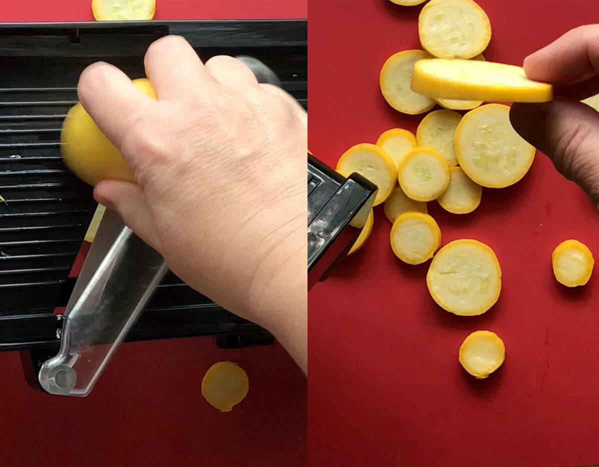 Squash being sliced on a mandoline.