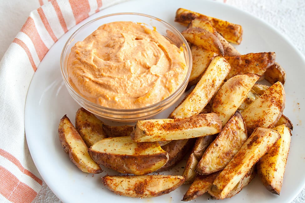 Spicy Baked French Fries on a plate.
