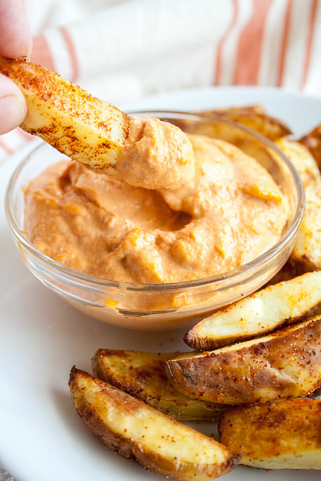 Spicy Baked French Fries with roasted red pepper dip.