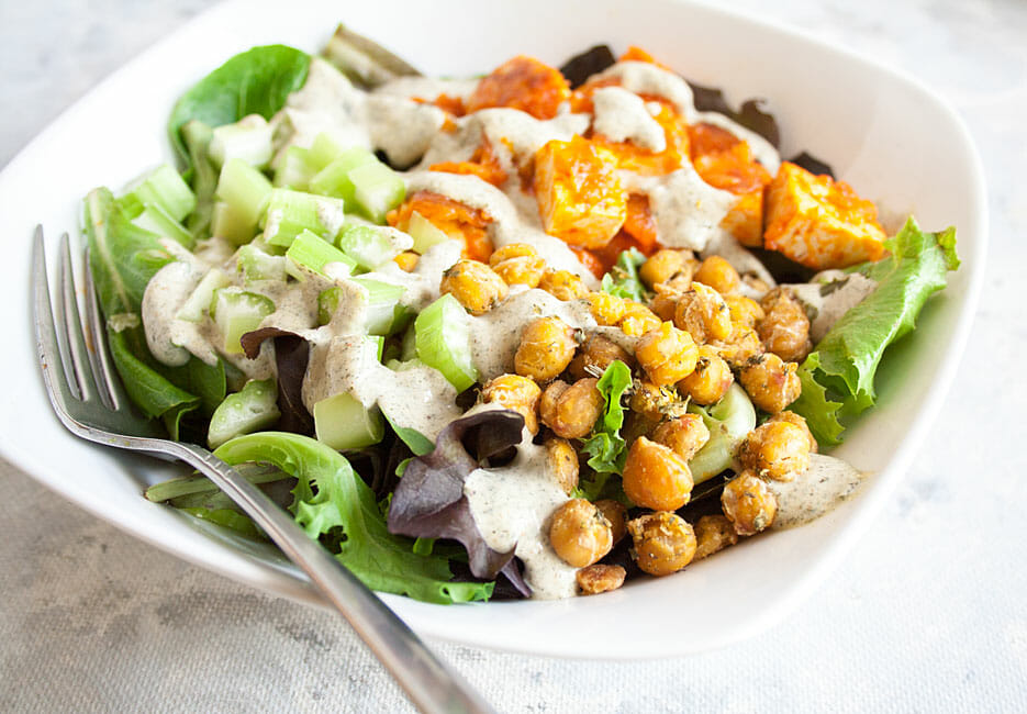 Buffalo Tofu Salad in a bowl. with fork close up.