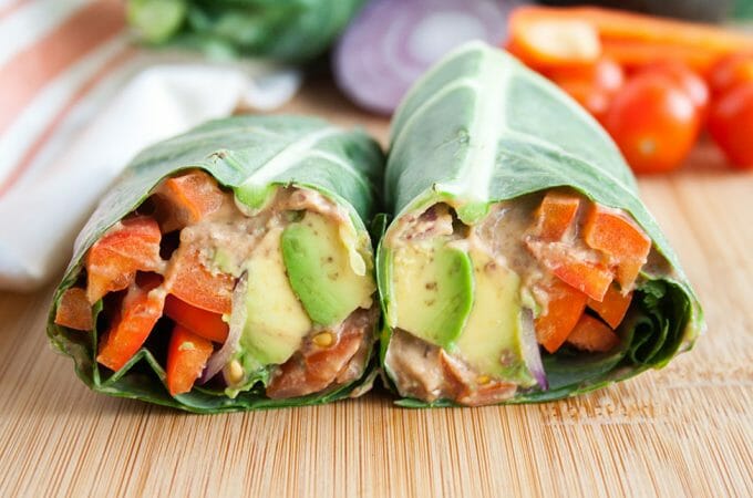 Black Bean Hummus Collard Wrap (vegan, gluten free) - This spicy vegan wrap is packed with flavor. You won't miss the bread with this easy meal! #collardwrap #veggiewrap #veganwrap