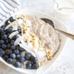 Spiced Chia Seed Porridge in a bowl with spoon.