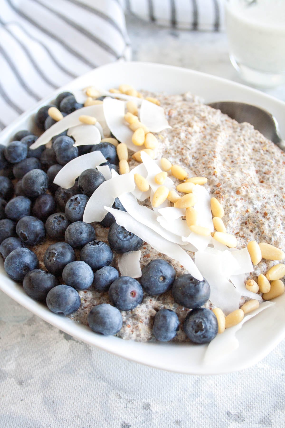 Spiced Chia Seed Porridge in a bowl with spoon.