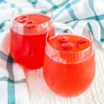 Raspberry Kombucha in two glasses.