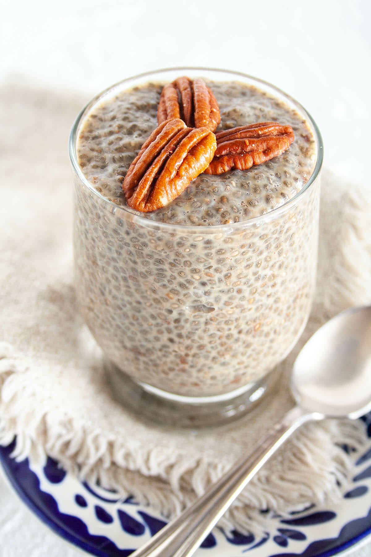 Gingerbread Chia Pudding with pecans on top.
