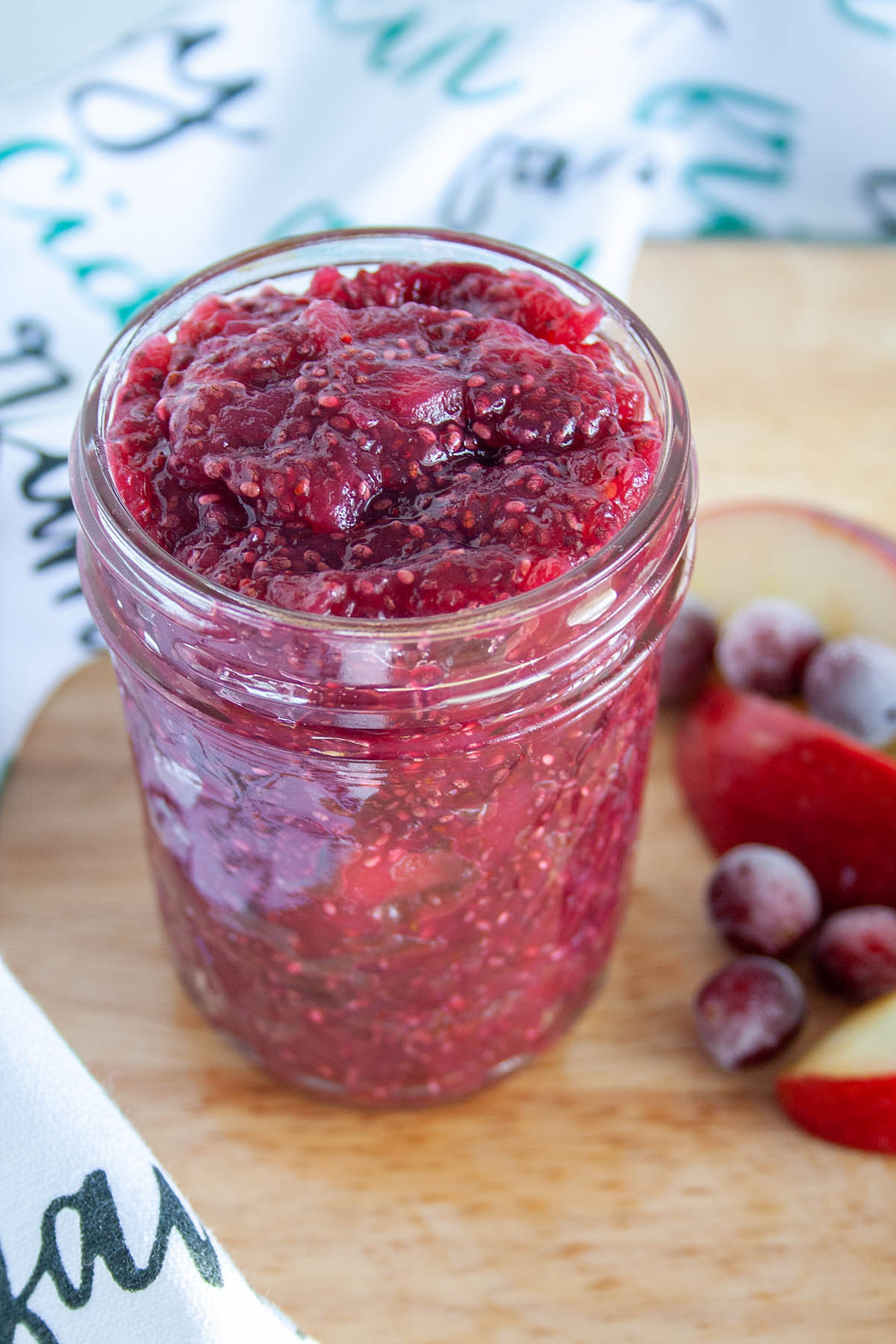 Cranberry Apple Chia Jam in a mason jar.