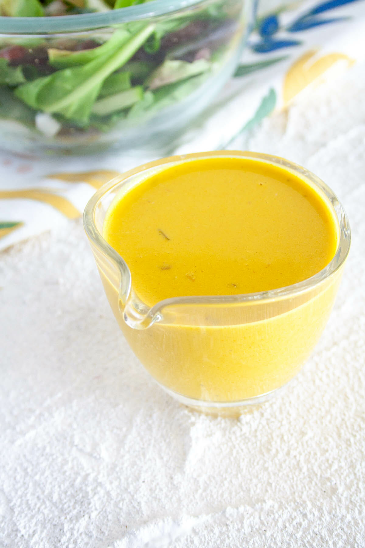 Turmeric Tahini Dressing in small pitcher. 