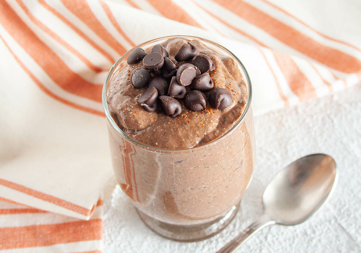 Mexican Chocolate Chia Pudding in jar with spoon.