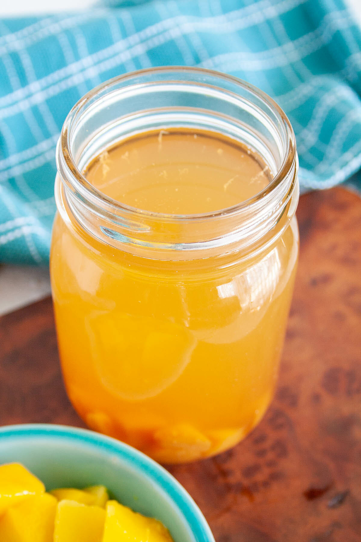 Mango Kombucha in mason jar.