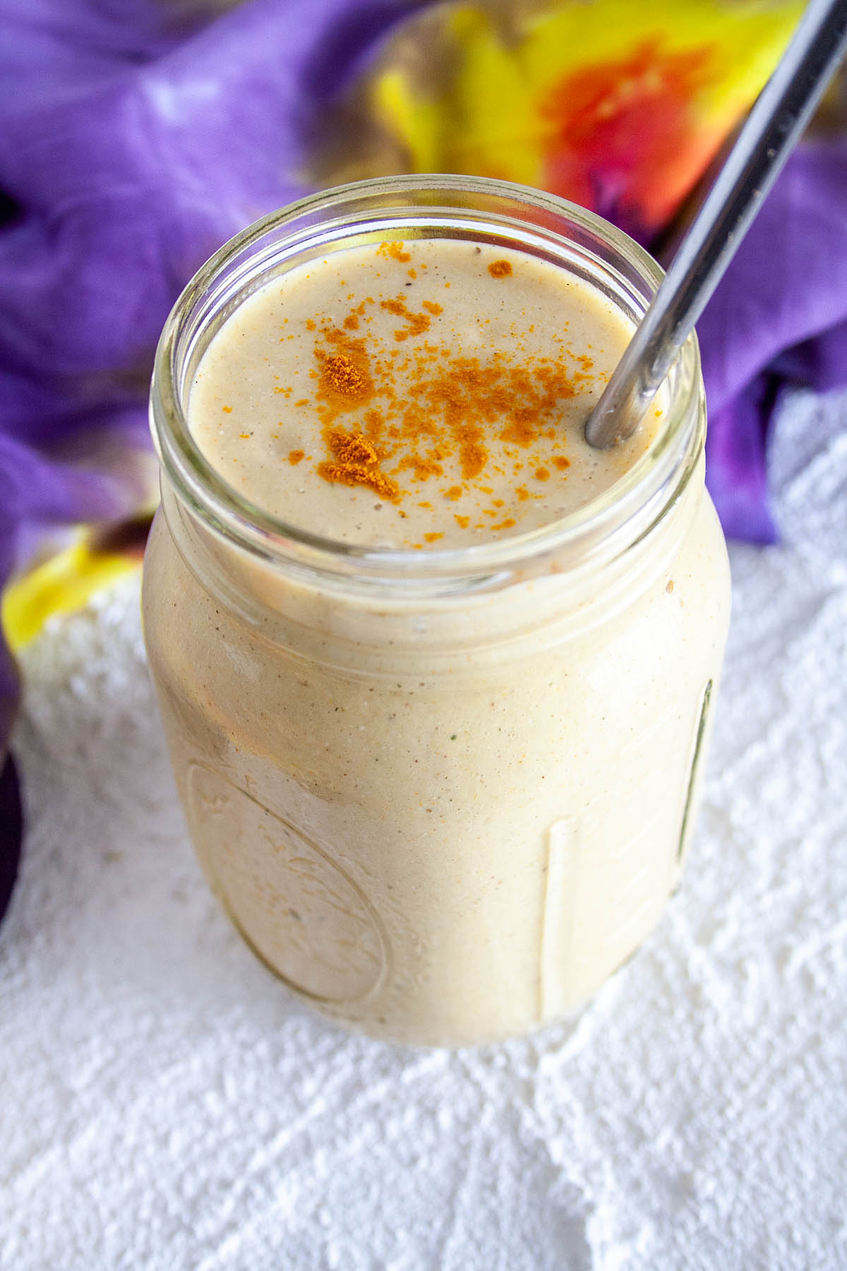 Turmeric Smoothie in a mason jar close up.