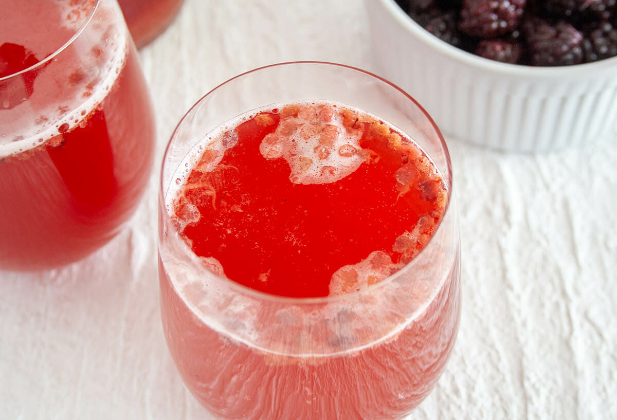 Blackberry Kombucha in two glasses.