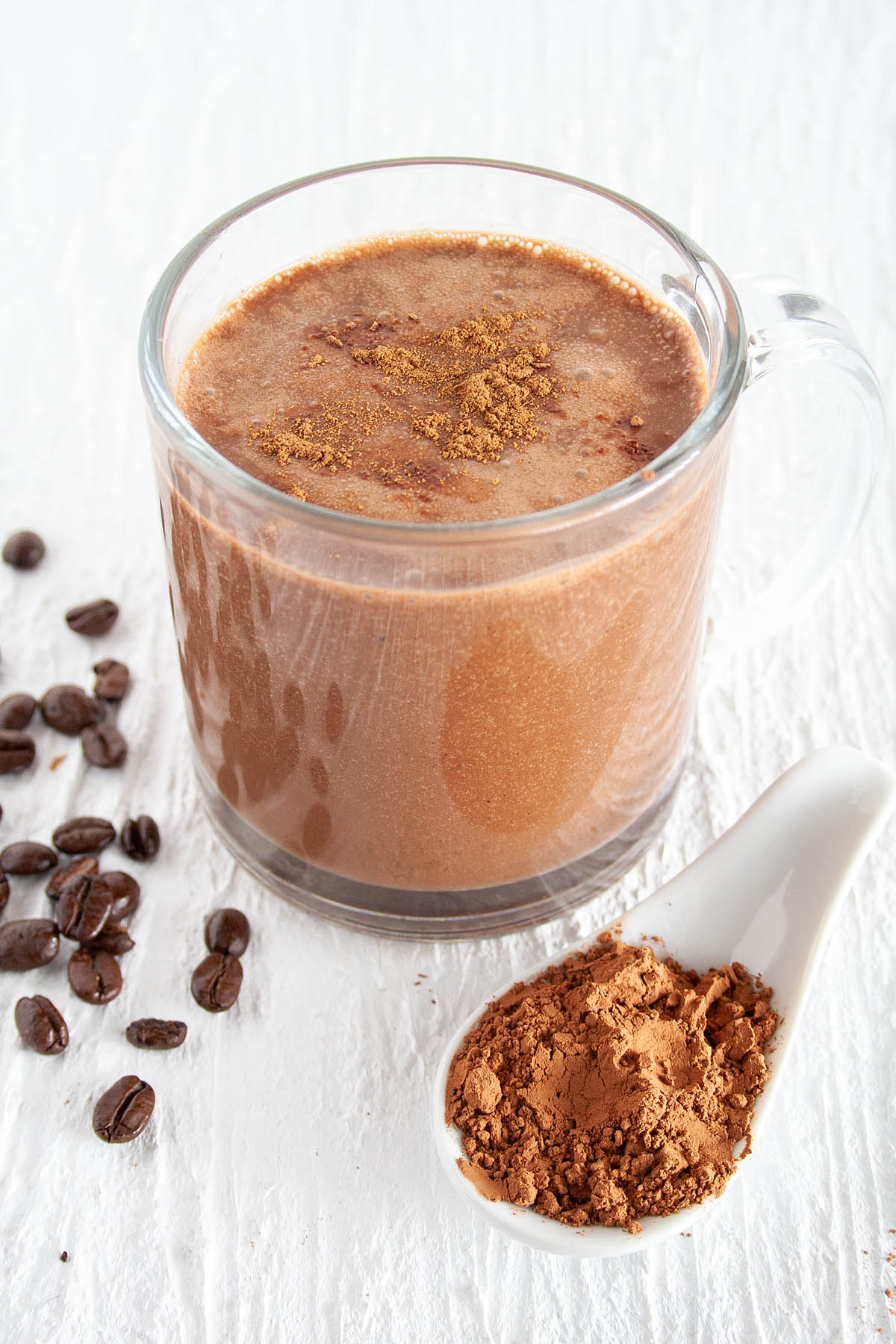 Spiced Mocha Latte with spoonful of cacao powder.