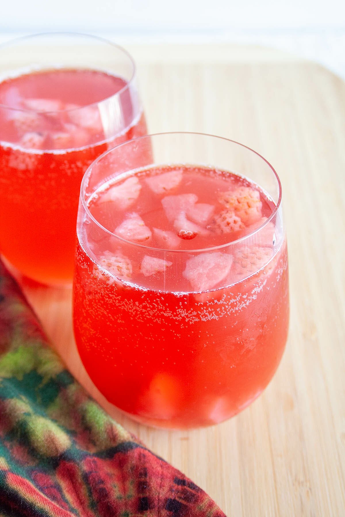 Strawberry Hibiscus Kombucha in two glasses close up.