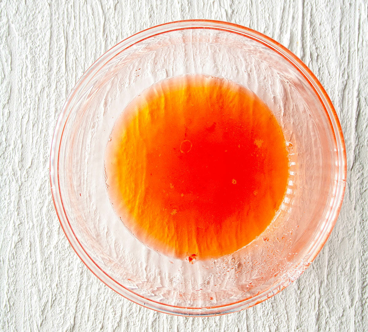 Strawberry Shrub after being strained and rice vinegar added.