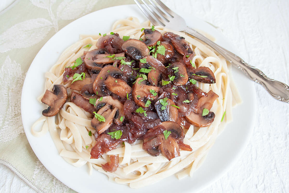 Caramelized Onion and Mushroom Pasta with fork.