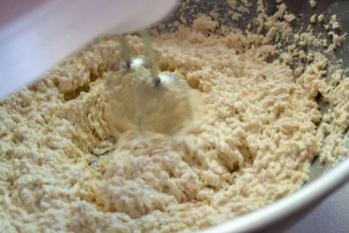 Mixing the corn and masa in a food processor.