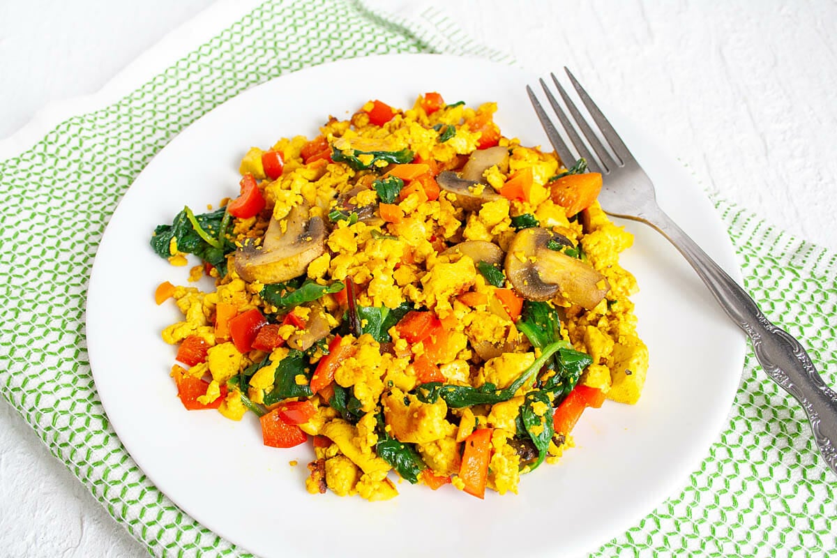 Tofu Scramble on a plate with fork.