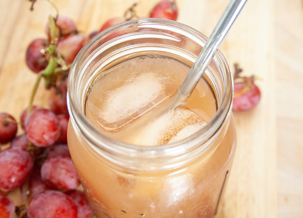 Grape Kombucha in mason jar close up.