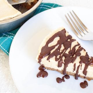 No-Bake Vegan Cheesecake on a plate with a fork.