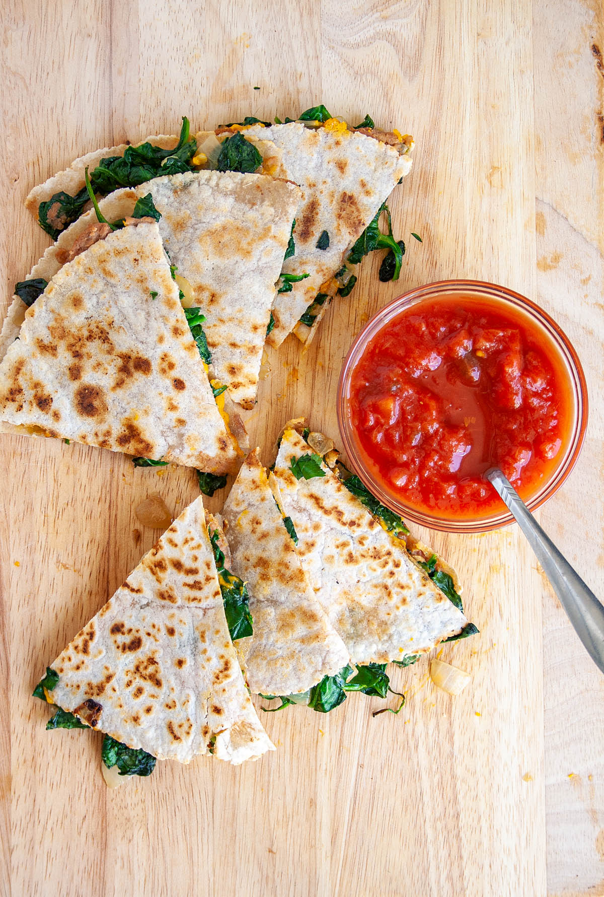 Spinach and Refried Bean Quesadilla with salsa.
