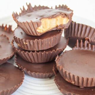 Vegan Peanut Butter Cups stacked on a plate.