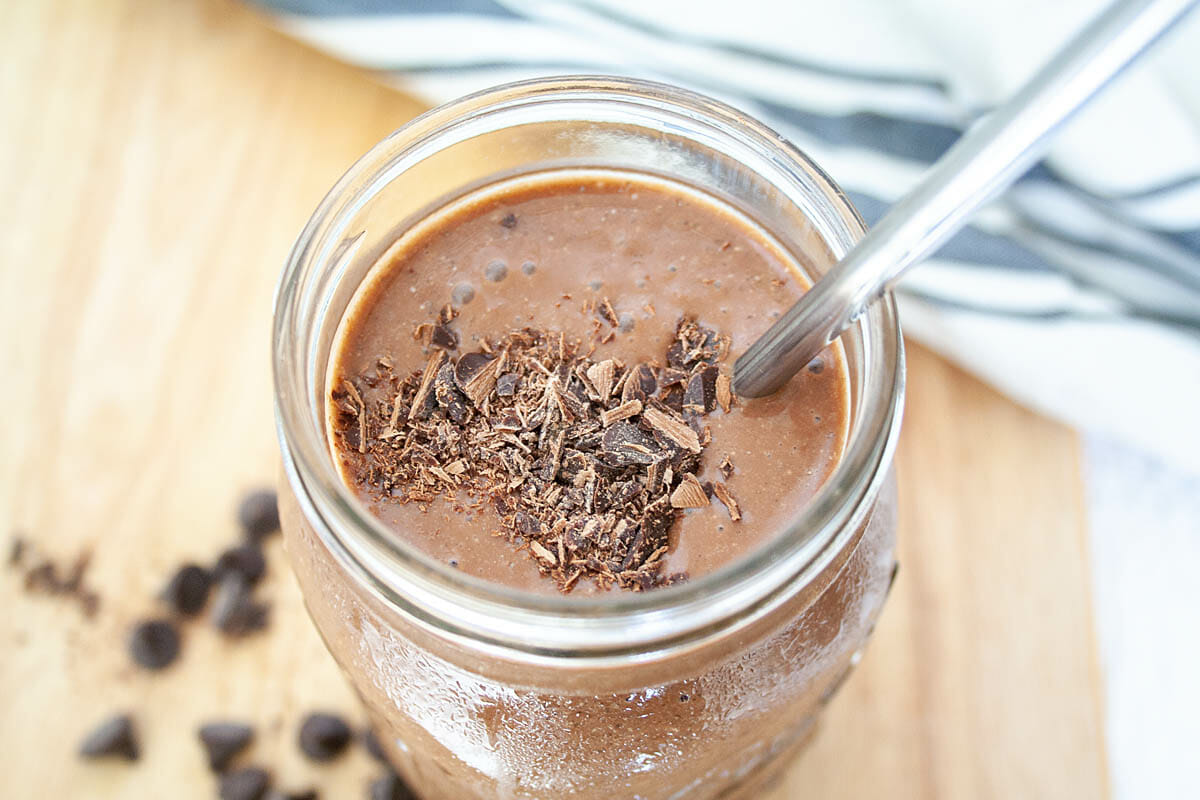 Chocolate Cauliflower Smoothie in mason jar with straw.