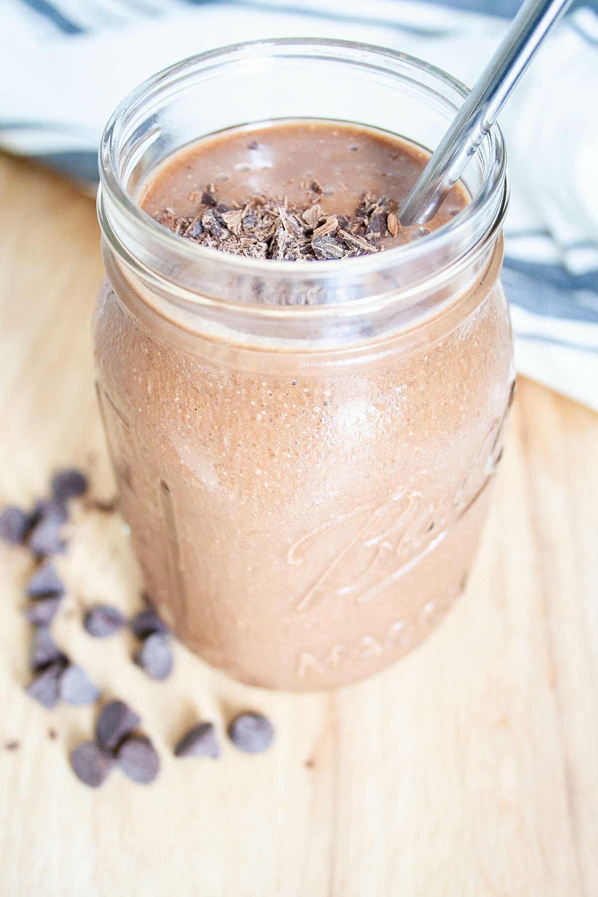 Chocolate Cauliflower Smoothie in mason jar with straw.