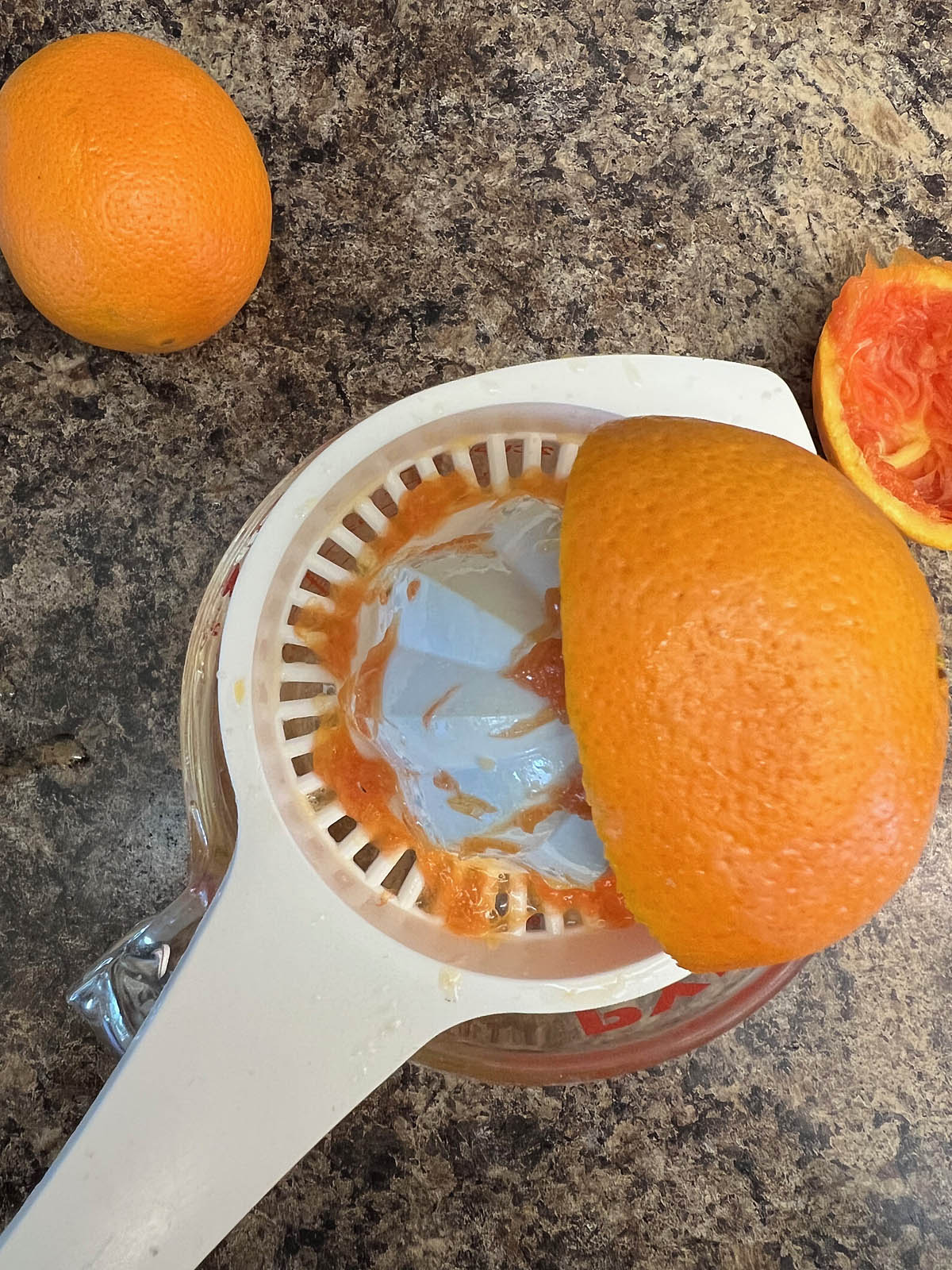 Orange being juiced.