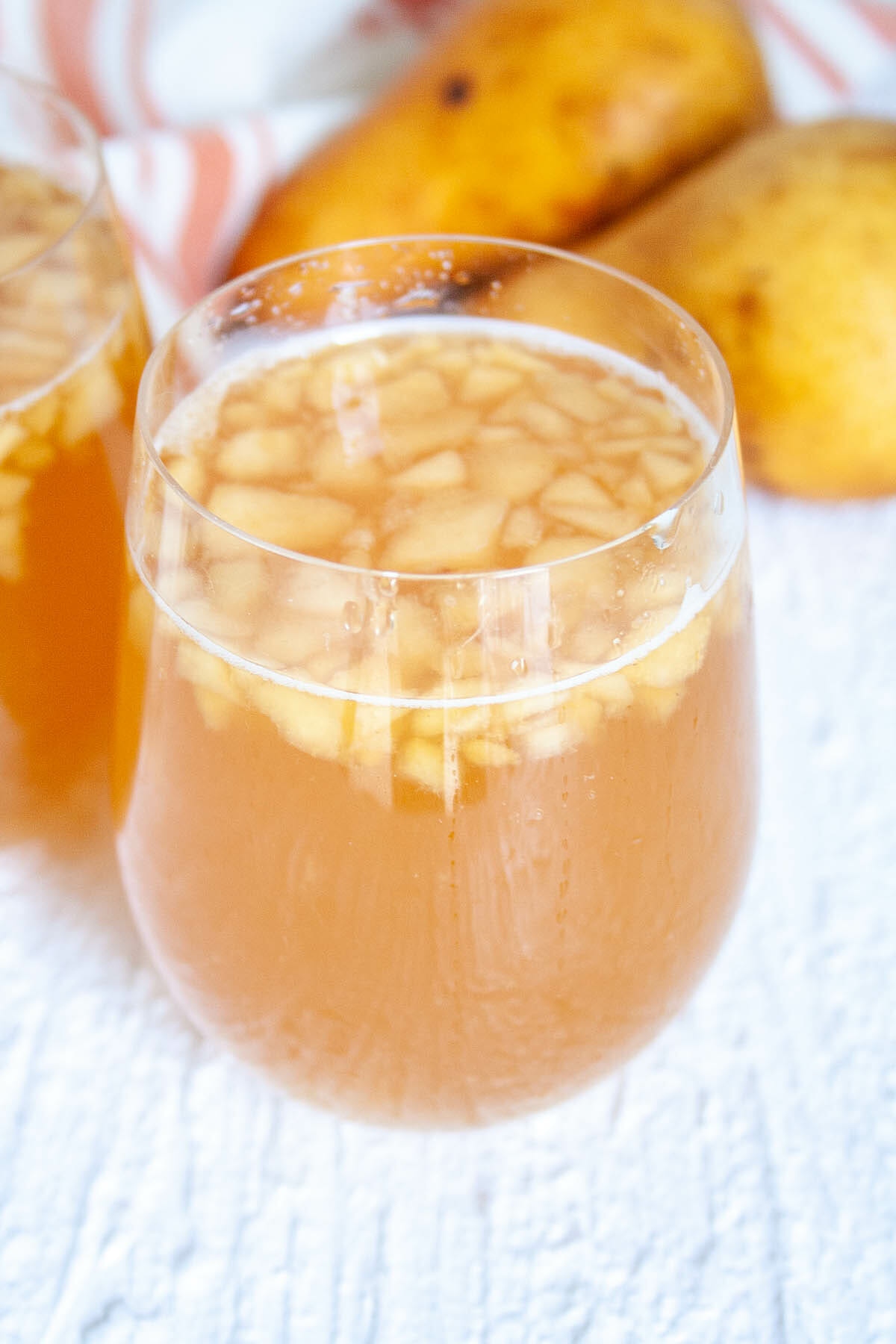 Pear Kombucha in two glasses close up.