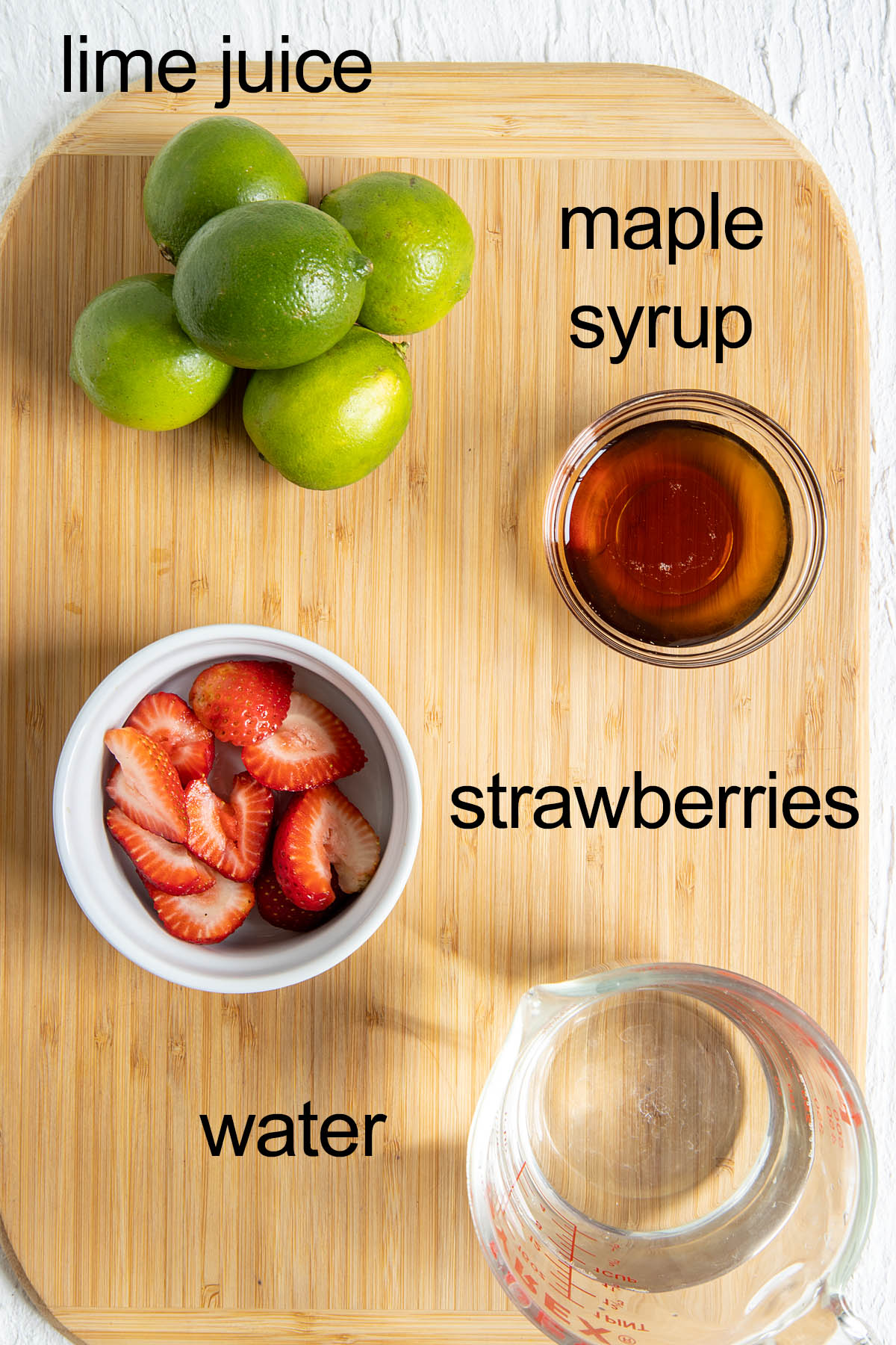 Ingredients on a cutting board with labels.