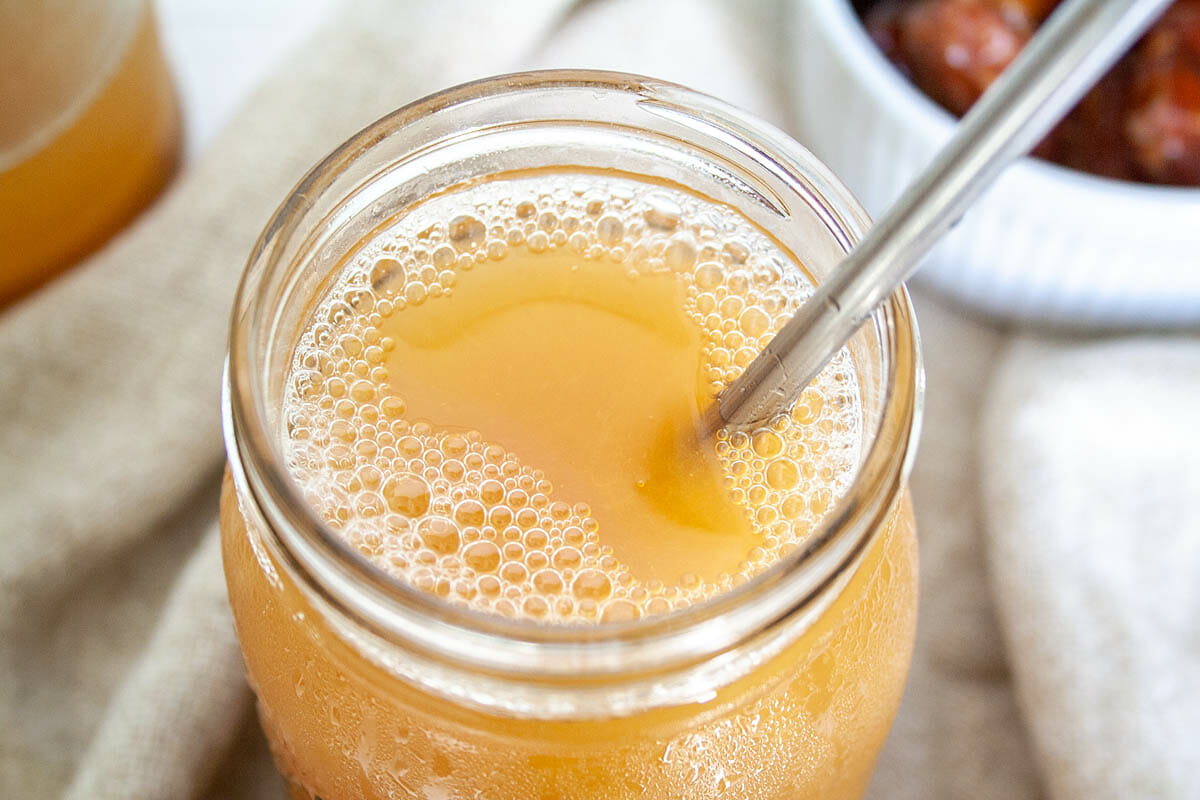 Date Kombucha in mason jar close up.