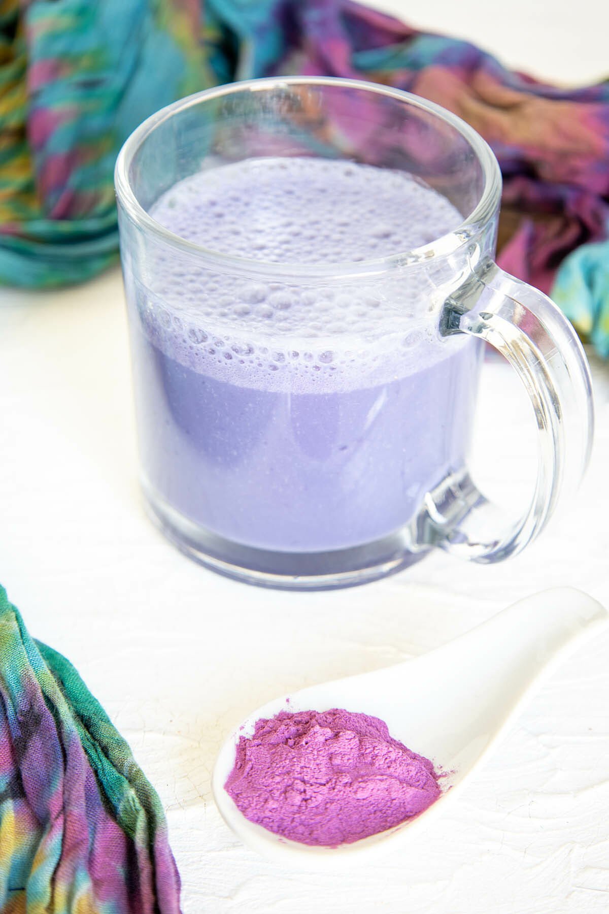 Purple Potato Latte with a spoonful of purple potato powder in the foreground.
