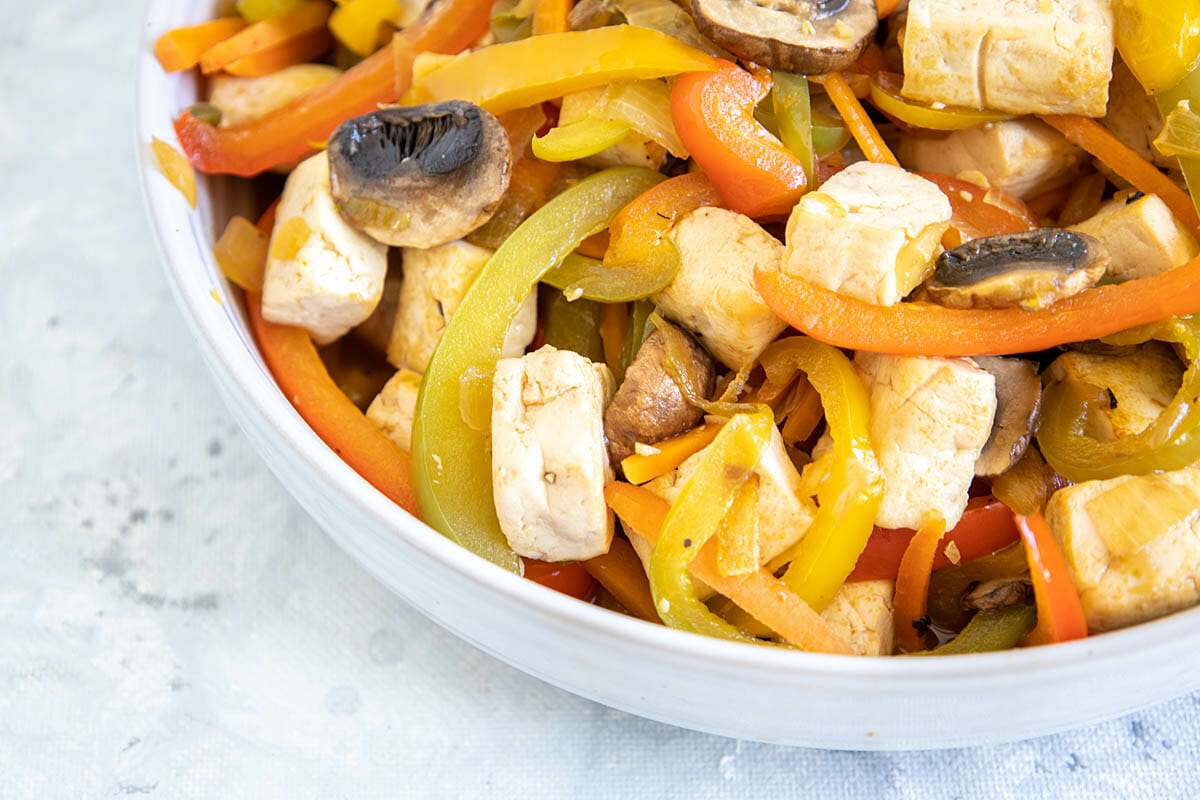Tofu Stir Fry with Bell Peppers in a bowl close up.