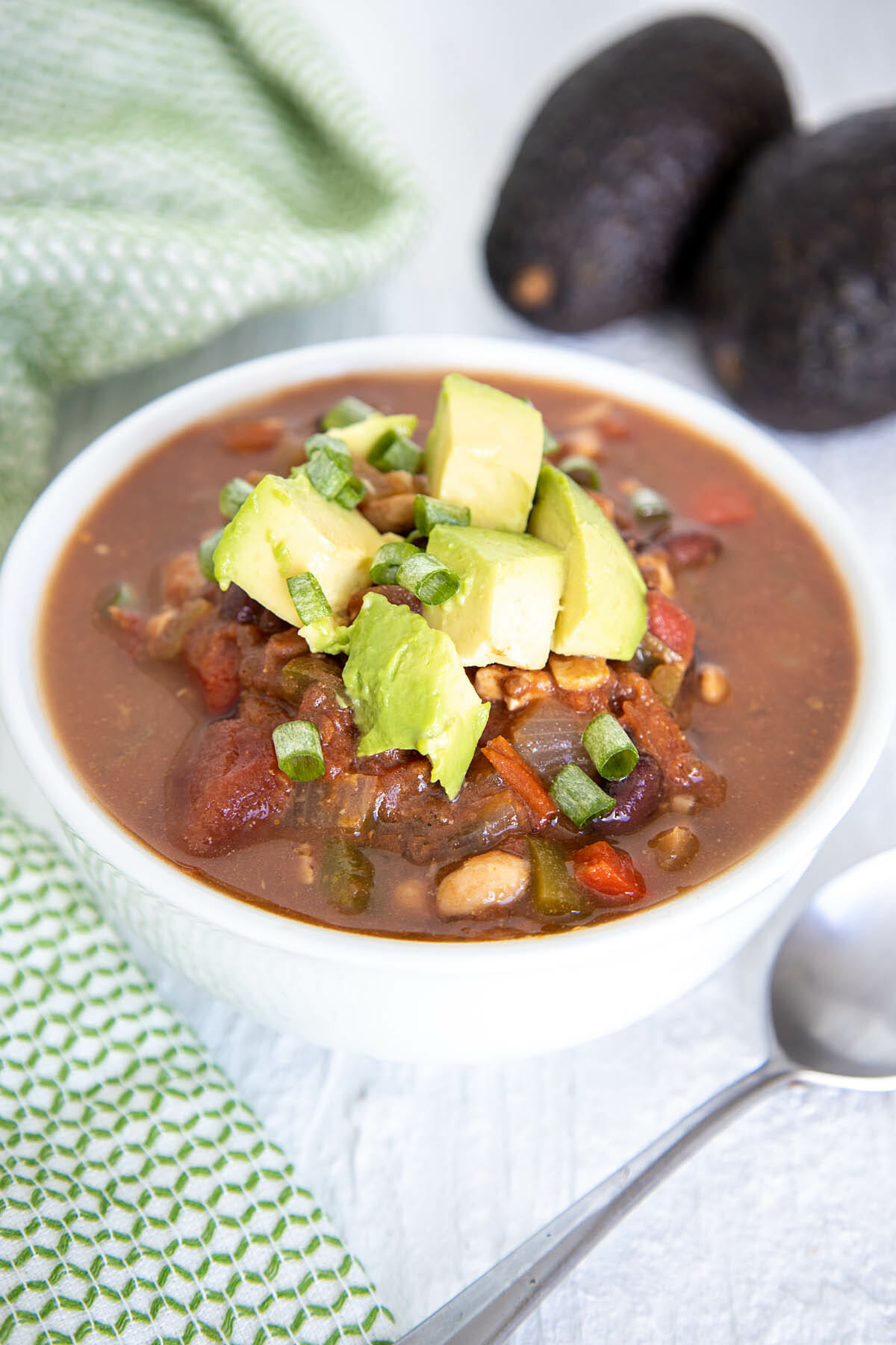 Slow Cooker Tempeh Chili in a bowl with spoon.