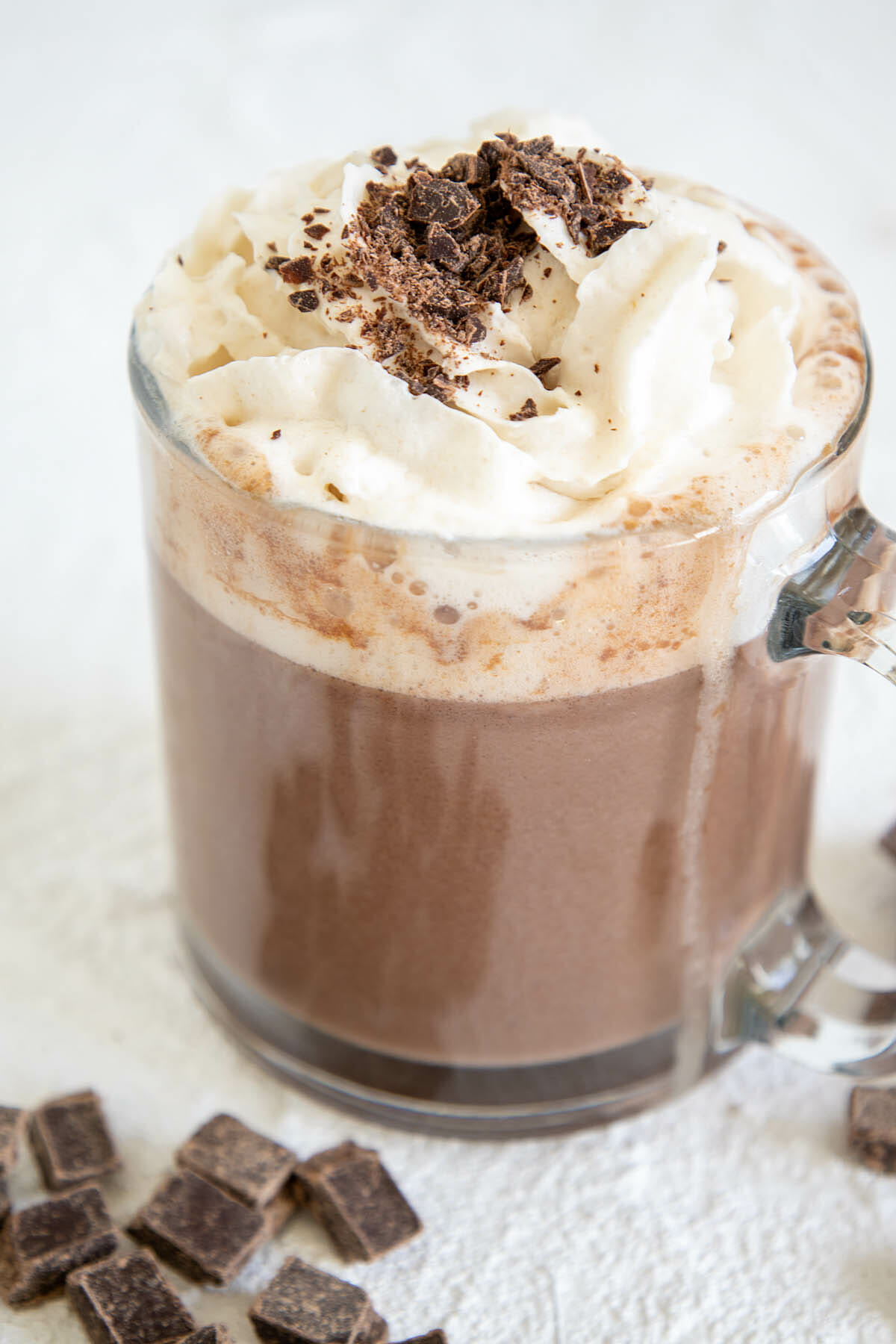 Vegan Hot Chocolate with vegan whipped cream and chopped chocolate.