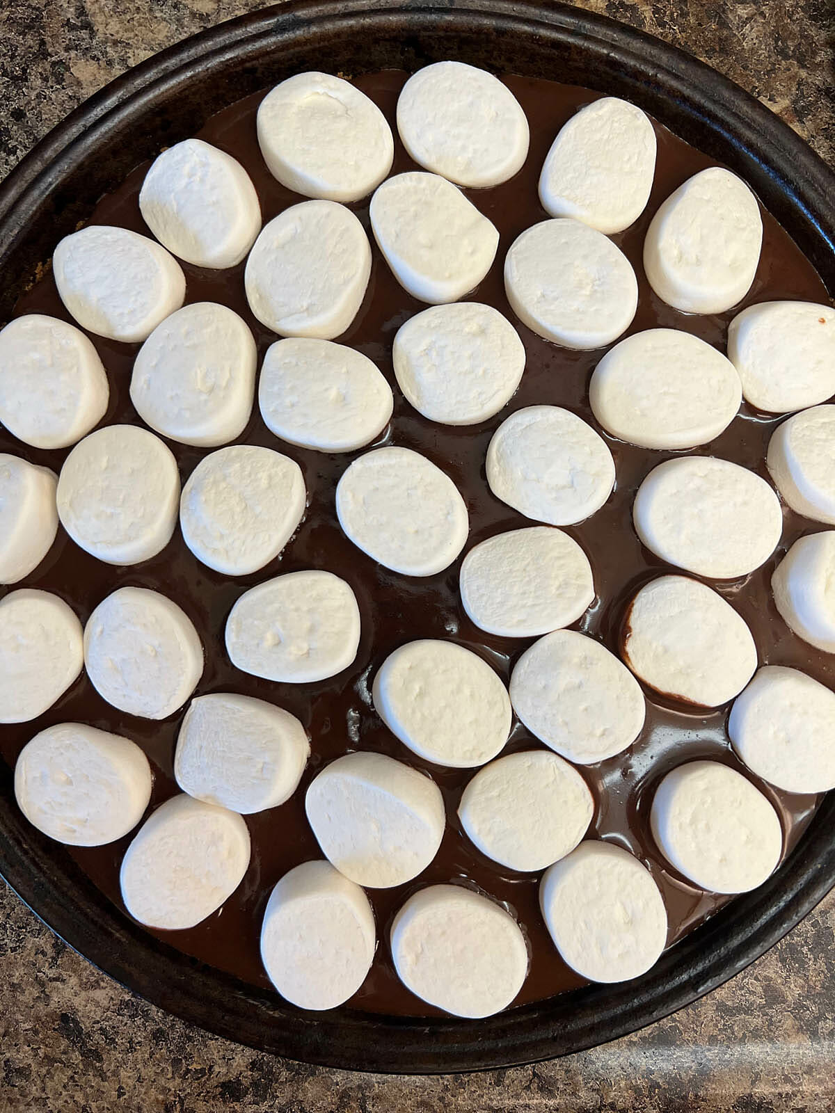 Marshmallows on top of chocolate.