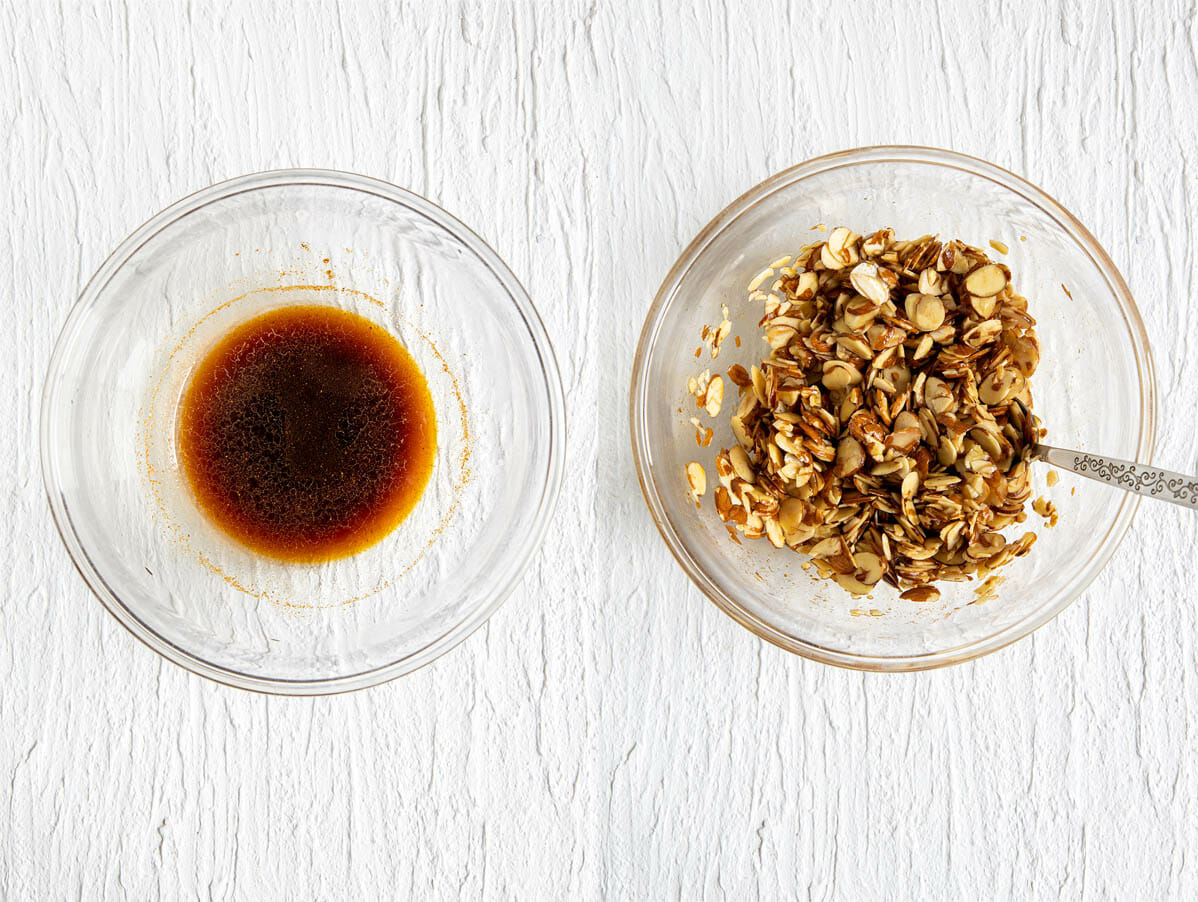 Marinade in a bowl and with sliced almonds.