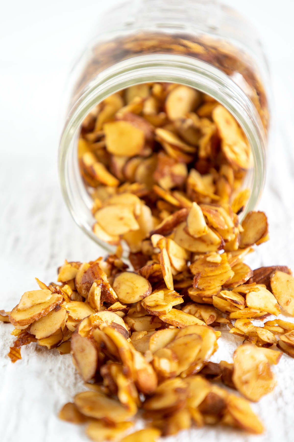 Almond Bacon spilling out of mason jar.