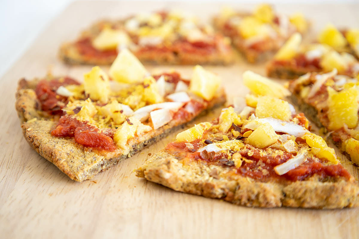 Vegan Cauliflower Pizza Crust on cutting board.