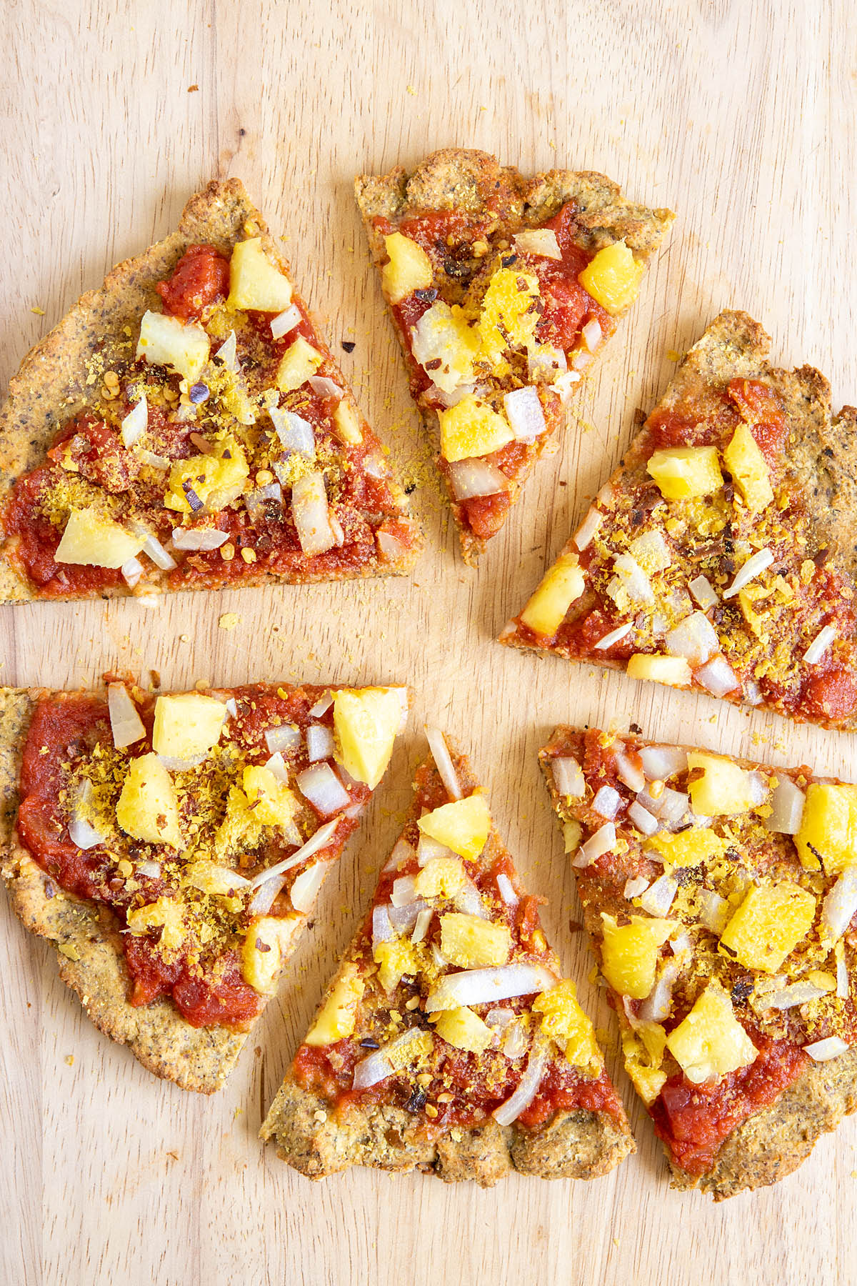 Vegan Cauliflower Pizza Crust on cutting board.