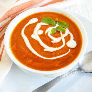 5 Ingredient Sun-Dried Tomato Soup in a bowl with spoon.