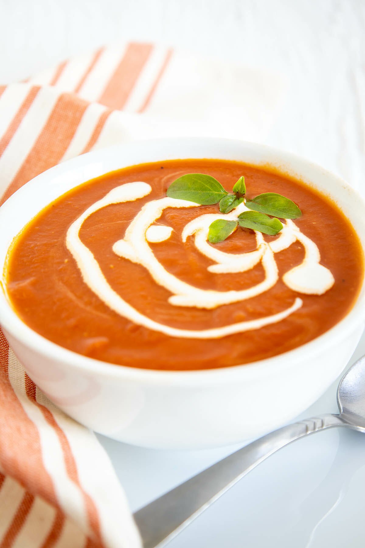5 Ingredient Sun-Dried Tomato Soup in a bowl with spoon.