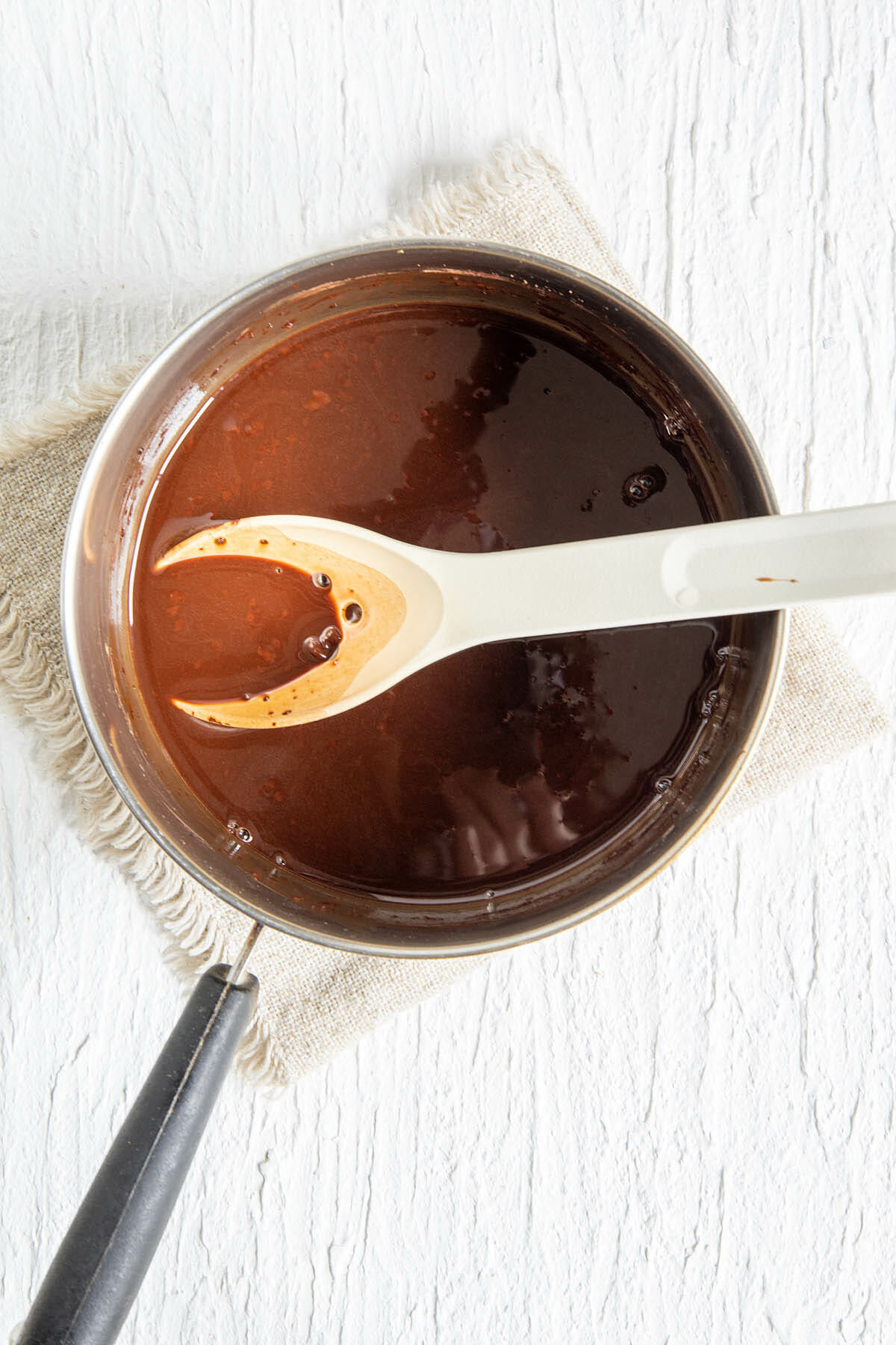 Chocolate simple syrup in a saucepan.