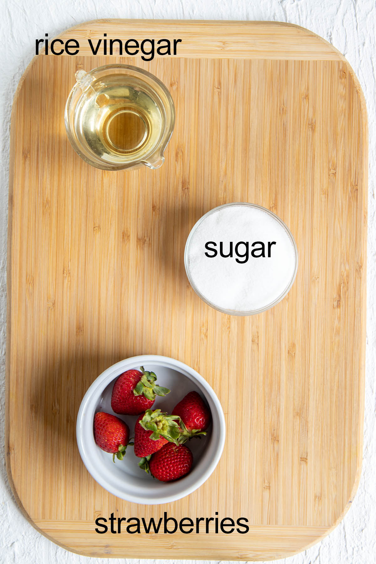 Ingredients on a cutting board with labels.