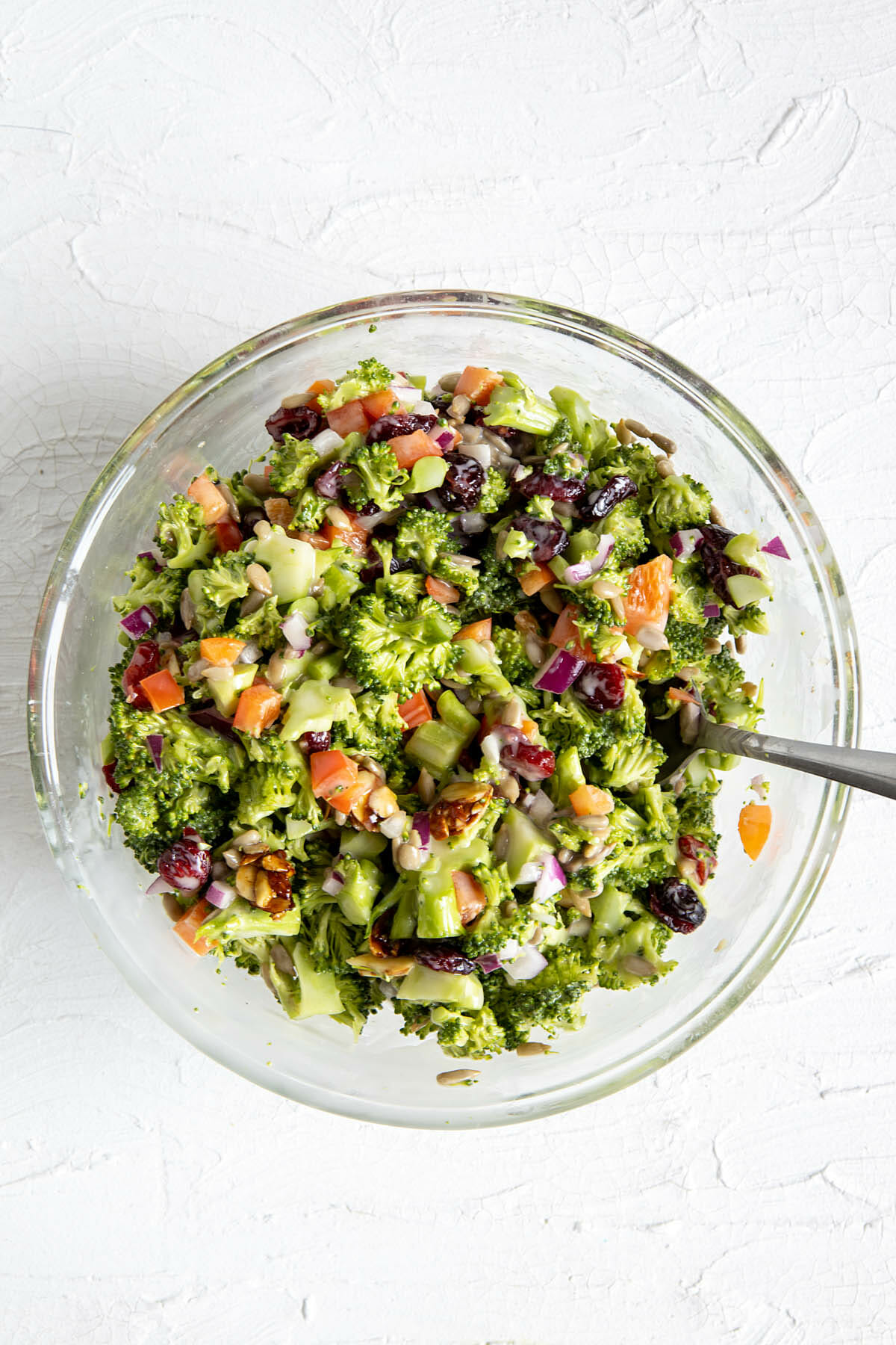 Vegan broccoli salad in a bowl after mixing.