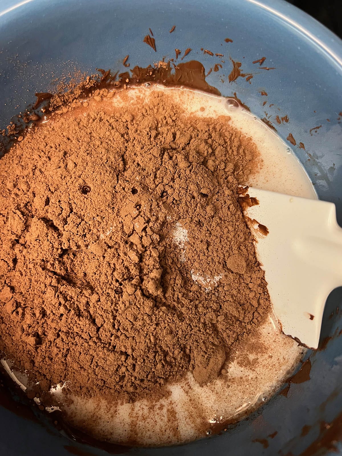 The rest of ingredients added to melted chocolate in a bowl.